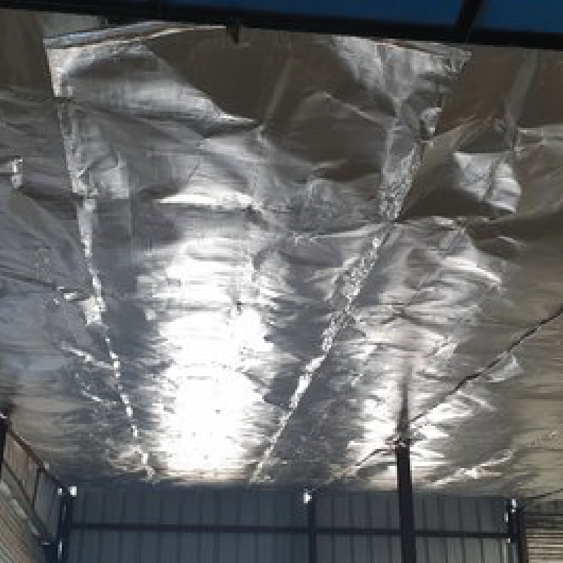 A metal structure with a ceiling covered in foil.