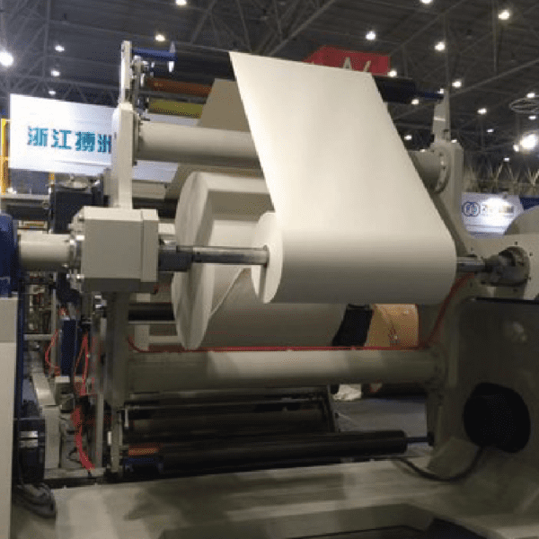 A machine that is cutting paper in to pieces.