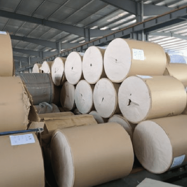 A warehouse filled with lots of rolls of paper.