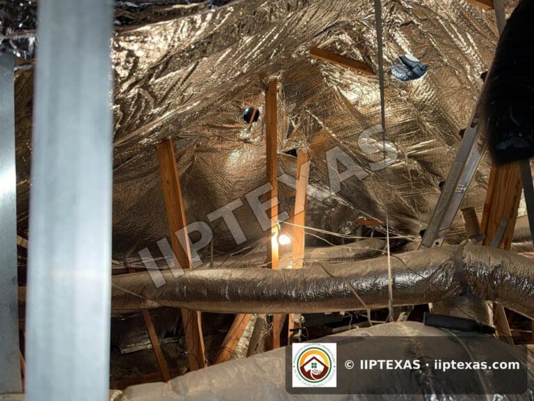 IIP Texas crew installing double bubble foil radiant barrier on attic rafters in the Dallas-Fort Worth area
