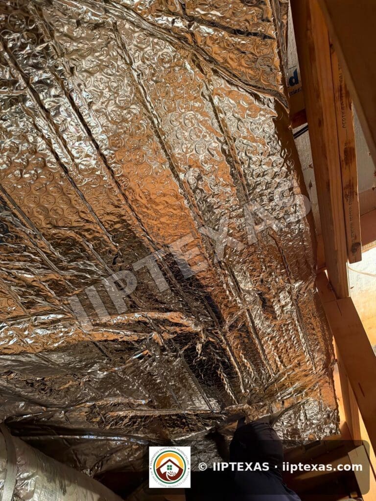 IIP Texas crew installing double bubble foil radiant barrier on attic rafters in the Dallas-Fort Worth area