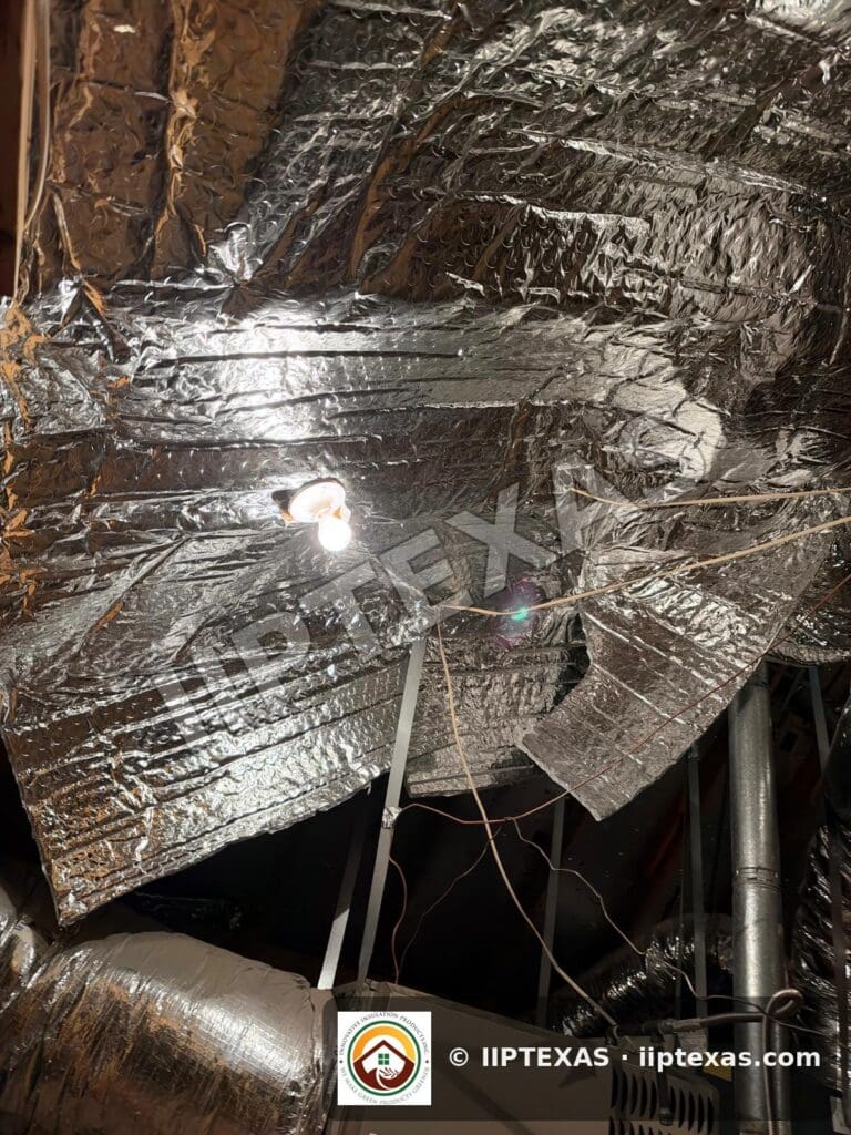 IIP Texas crew installing double bubble foil radiant barrier on attic rafters in the Dallas-Fort Worth area