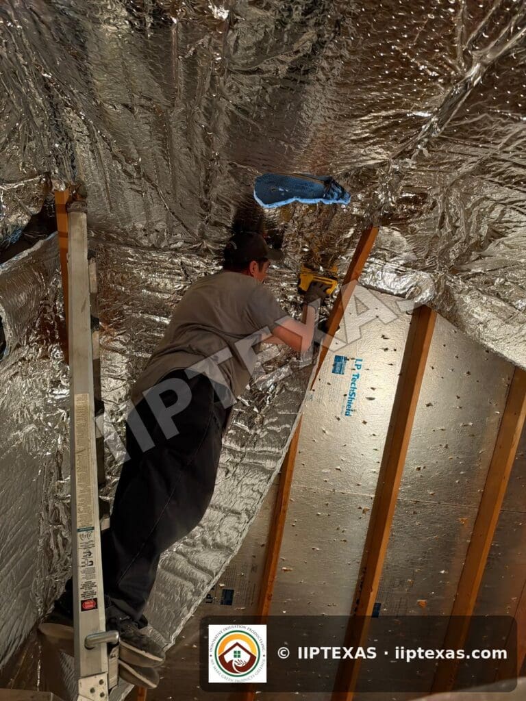 IIP Texas crew installing double bubble foil radiant barrier on attic rafters in the Dallas-Fort Worth area