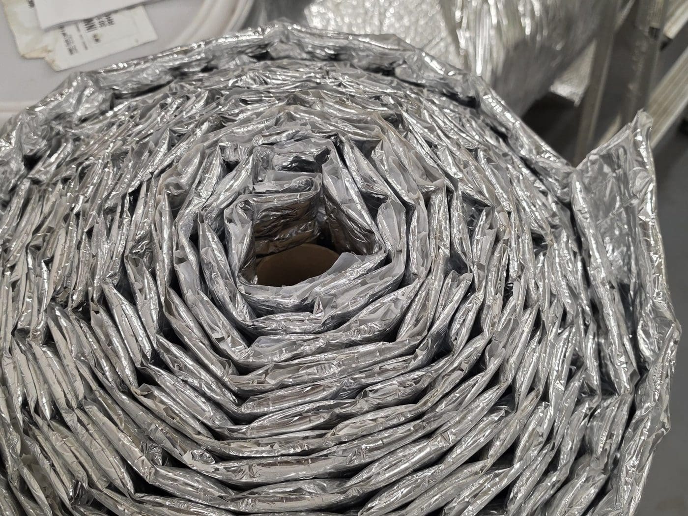 End of a roll of IIP Superbubble foil/foil 1 inch reflective insulation, showing the thick air-cell layers